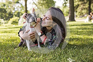 Woman with terrier dog outside at the park