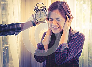 Woman terrified of alarm clock sound