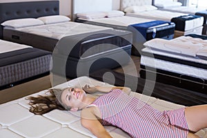 woman testing a commodious mattress