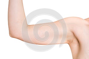 Woman is testing her muscle under her arm