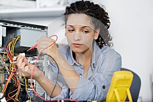 Woman testing motherboard