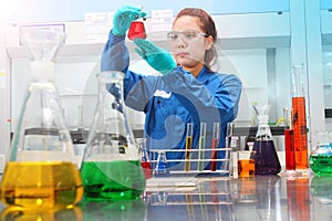 Woman testing solution chemical analysis laboratory chemistry industry