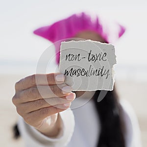 Woman and text non-toxic masculinity in a note