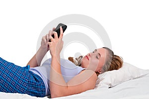 Woman Texting in Bed