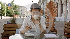 Woman texting. Closeup young happy smiling cheerful beautiful girl looking at mobile cell phone reading sending sms