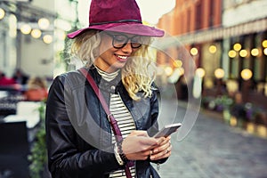 Woman texting on her smartphone photo