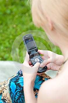 Woman texting on mobile phone