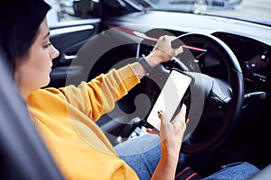 Woman Texting On Mobile Phone Whilst Driving Car