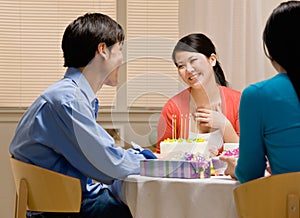 Woman thanking husband for birthday cake photo