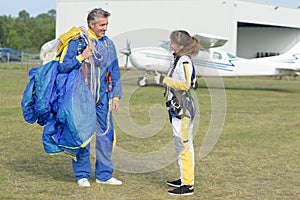 Woman thanks instructor after tandem skydive