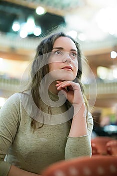 Woman theatre goer looking at dramatics play