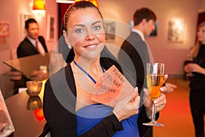 Woman in theatre presenting tickets