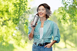 Woman with thermo cup or tumbler for hot drinks