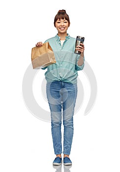 woman with thermo cup or tumbler for hot drinks