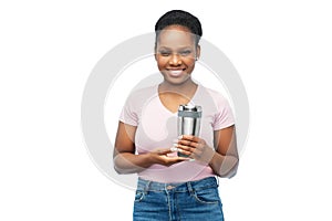 woman with thermo cup or tumbler for hot drinks