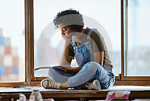 Woman, thinking and drawing by window in art studio, Indian creative gallery and designer workshop. Artist, painter or