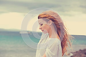 Woman thinking enjoying nature sea shore