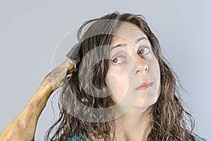 Woman thinking with ham leg in her head. Stupid situation