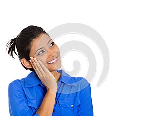 Woman thinking hand on cheek looking up having an idea