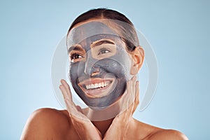 Woman thinking, mask and facial charcoal for skincare, natural beauty and cosmetics benefits on studio, blue background