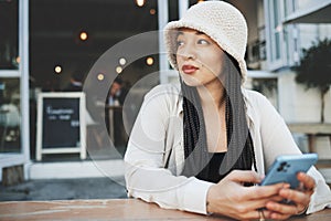 Woman, thinking and phone for communication, network and internet chat with technology or connectivity. Smartphone