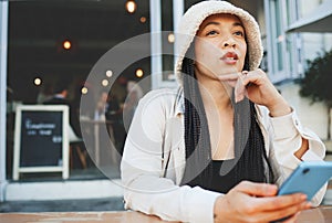 Woman, thinking and phone for communication, social media and internet chat with technology or connectivity. Smartphone