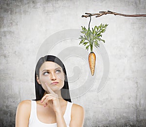 Woman thinking about reward photo