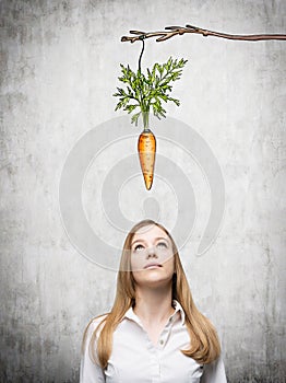 Woman thinking about reward photo