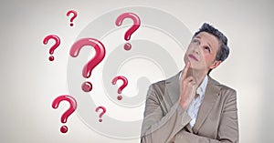 Woman thinking with shiny pink question marks
