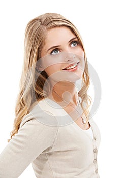 Woman, thinking and smile in studio for ideas, planning insight and daydream of future on white background. Happy model
