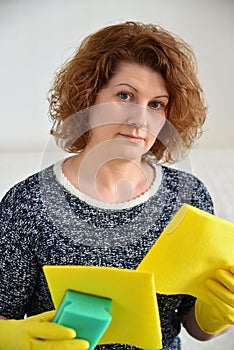 Woman thinks about the upcoming cleaning in house