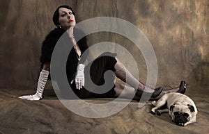 Woman in thirties style with pug dog