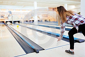 Woman throwing bowling ball