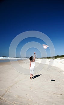 Woman throwing hat in air