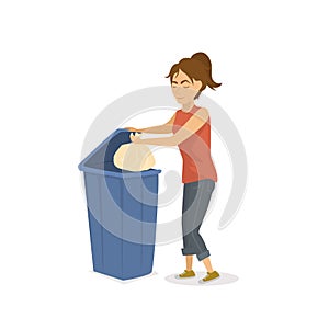Woman throwing plastic trash garbage in a trash bin
