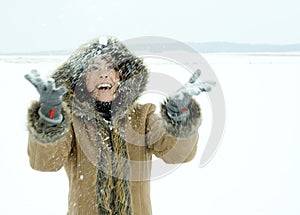 Woman throwing snow