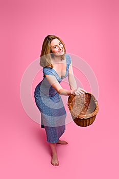 Woman throwing wicker basket