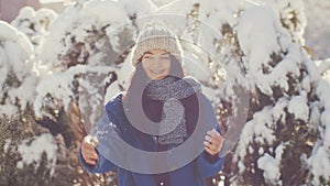 Woman throws snowball hitting camera. Slow motion 4K hogh quality sharp footage.