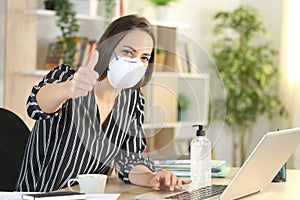 Woman with thumbs up teleworking in coronavirus quarantine