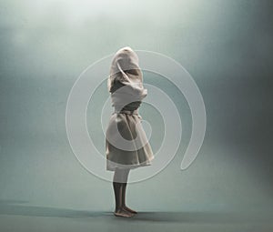 Woman tied and hidden by a white veil