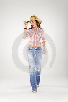 Woman tilting cowboy hat