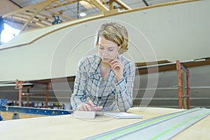 Woman tinkering in home workshop