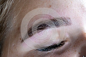 Woman tinted eyebrow of correct shape and natural color