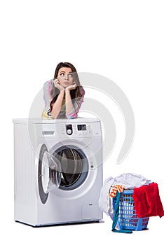 The woman tired after doing laundry isolated on white