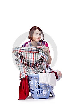 The woman tired after doing laundry isolated on white