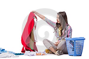 The woman tired after doing laundry isolated on white