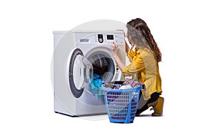 The woman tired after doing laundry isolated on white