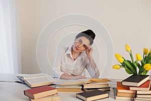 Woman tired of preparing for exam sleeps