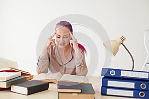 Woman tired work in the Office and reading books