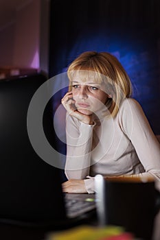 Woman tired while working late